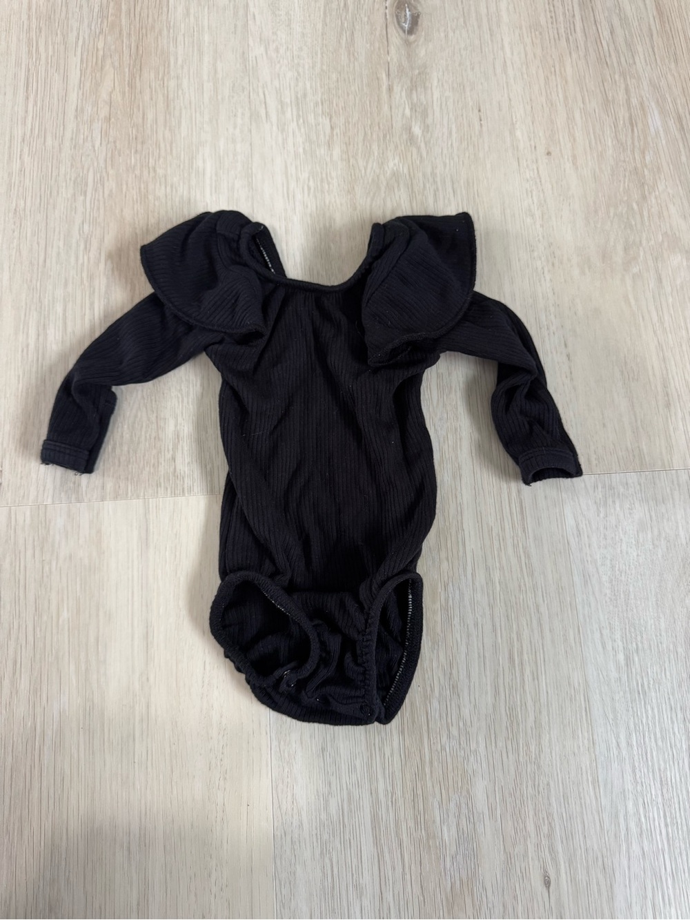 Kyte Baby Black Long-Sleeve Ruffle One-Piece